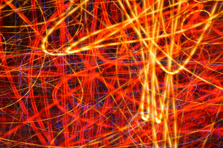 Luminous streamer - neon bright lines on black background.の写真素材