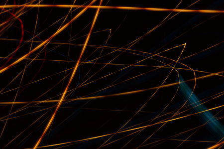 Luminous streamer - neon bright lines on black background.の写真素材