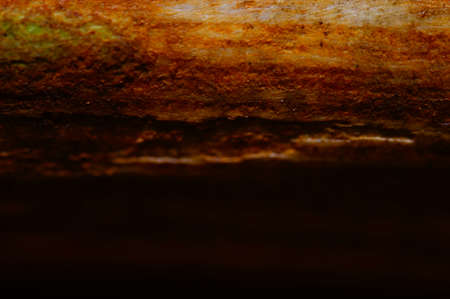 Orange and black smudged abstract background. Honey-colored horizon for text and graphics. Soft transition from light to dark. Fiery, shimmering glow.の写真素材