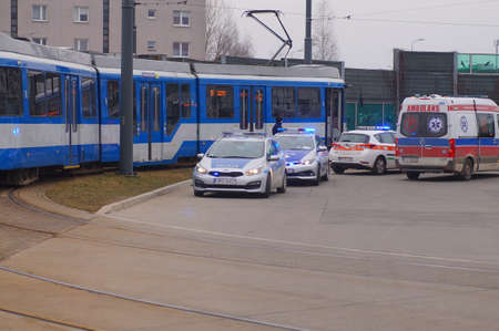 Accident involving streetcar and passenger - police, medical and traffic police cars. The place of the incident in Krakow - streetcar terminus Maly PÅaszow. Krakow, Poland - 03/11/2021のeditorial素材