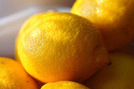 Lemons in a basket on a white background. Close up.の写真素材