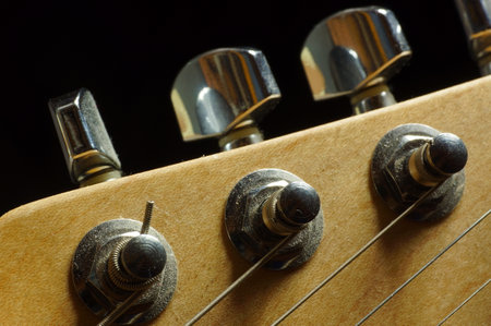 Detail of the fretboard of a guitar with shallow depth of fieldの写真素材