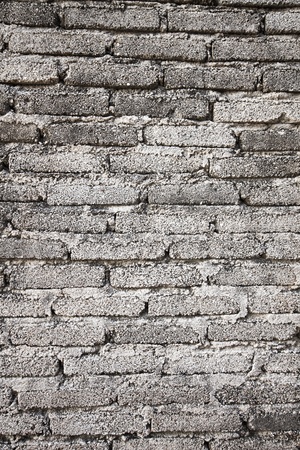 gray brick-wall texture strong very muchの写真素材