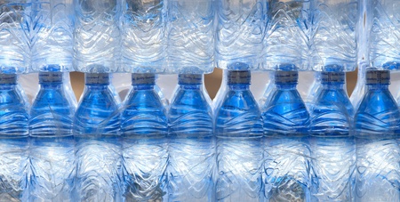 Rows of water bottles isolated on white backgroundの写真素材