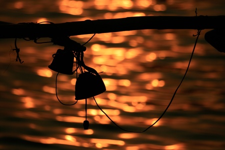 small Bell silhouette in boat of fisherman at koh samui thailandの写真素材