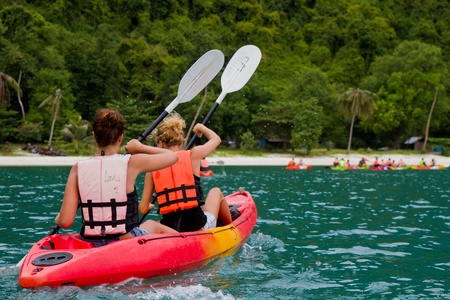 traveler kayaking in the thai ocean from backward viewの写真素材