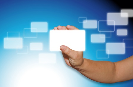 business card in hand on blue backgroundの写真素材