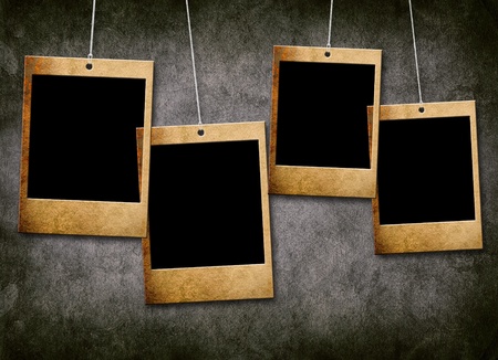 Blank photographs on a grungy paper backgroundの写真素材
