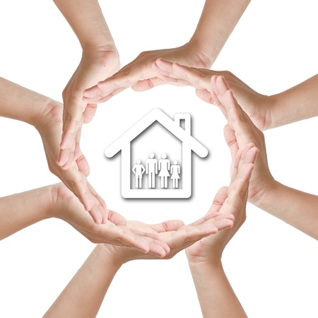 Multiracial woman hand around home familyの写真素材