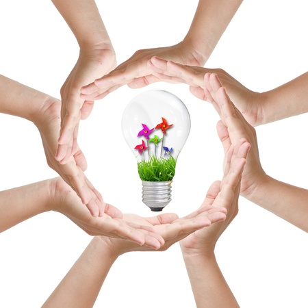 Multiracial woman hands making a circle with Light bulb toyの写真素材