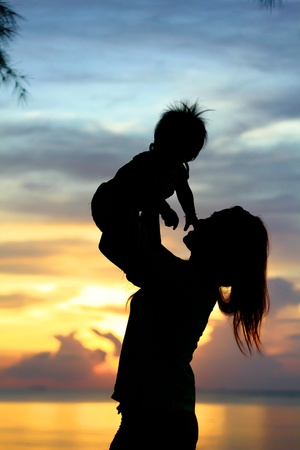 Mother & Baby Silhouette  in sunset timeの写真素材