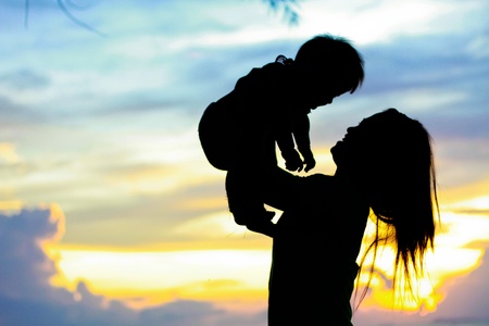 Mother & Baby Silhouette  in sunset timeの写真素材