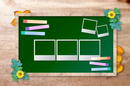chalkboard with photo frame on wood background