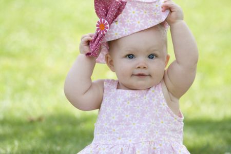 this is a baby with Pink a hatの写真素材