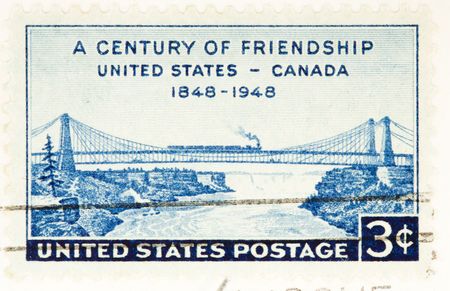 USA - CIRCA 1948: A stamp printed by USA celebrate a century of friendship between Canada and USA circa 1948の写真素材