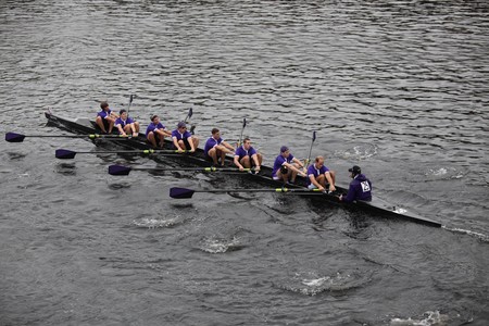 BOSTON - OCTOBER 24: College of Holy Crossmen's Crew competes in the Head of the Charles Regatta on October 24, 2010 in Boston, Massachusetts. のeditorial素材