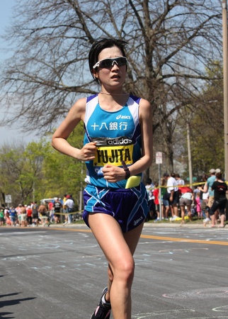 BOSTON - APRIL 16: Mayumi Fujita (Japan) races up Heartbreak Hill during the Boston Marathon on April 16, 2011 in Boston. Sharon Cherop (Kenya) finished first with a time of 2:30:50. のeditorial素材