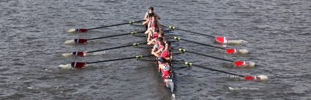 BOSTON - OCTOBER 21 Fairport Crew Club races in the Head of Charles Regatta, Marin Rowing Association won with a with a time of 12:59 on October 21, 2012 in Boston, MA. のeditorial素材