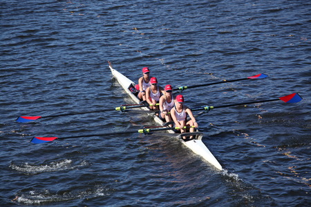 BOSTON - OCTOBER 20  Marina Aquatic Center Junior Rowing  USA  races in the Head of Charles Regatta on October 20, 2013 in Boston, MAのeditorial素材