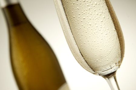 Champagne glass bottle with drops on the glassの写真素材