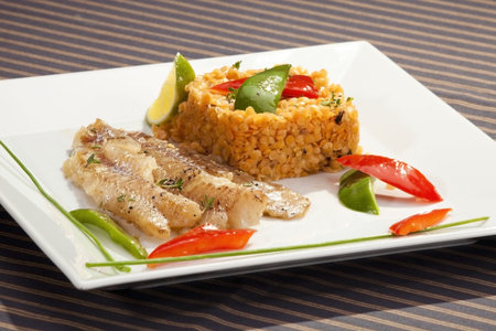 Grilled codfish with red lentil and bell pepper slices