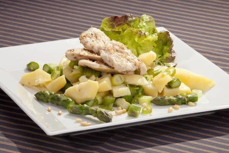 Grilled chicken breast w pine nuts and sesame seedsの写真素材