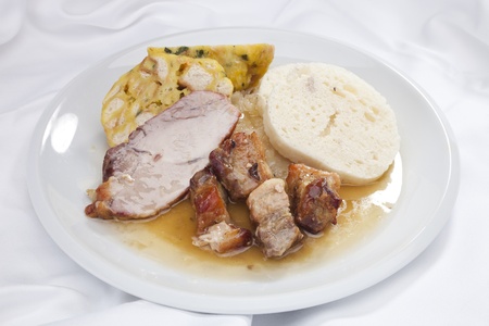 Baked pork chop w twoo different dumplings and sauerkrautの写真素材
