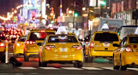 NEW YORK CITY - SEPT 22: Eight Avenue, featured with Taxi Cabs, Shops and animated LED signs, is a symbol of New York City and the United States, September 22, 2012 in Manhattan, New York Cityのeditorial素材