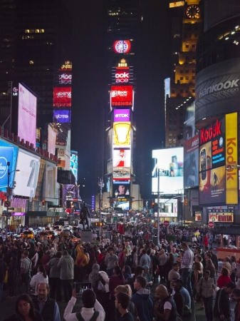 NEW YORK CITY - SEPT 28: Times Square, full of tourists from all the world's countries, featured with Broadway Theaters, Taxi Cabs and animated LED signs, is a symbol of New York City and the United States. September 28, 2012 in Manhattan, New York Cityのeditorial素材