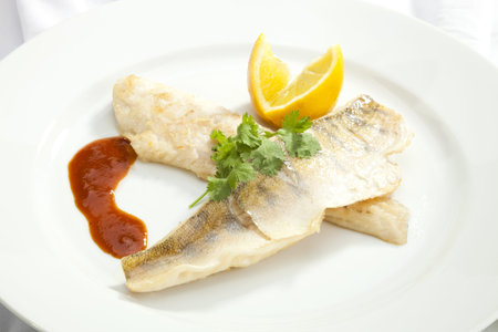 Grilled Pike perch with lemon and tomato sauce