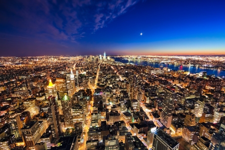 New York City and New Jersey skyline at night w the Freedom tower and Brooklyn bridgeの写真素材