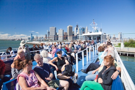 NEW YORK - SEPTEMBER 23: The open deck Governors Island Ferry departs from Brooklyn Park in New York City on September 23, 2012. It is a free weekend rides that offers great views of the skyline of New York.のeditorial素材