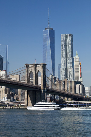 The New York City Downtown w Brooklyn Bridge and Freedom towerの写真素材