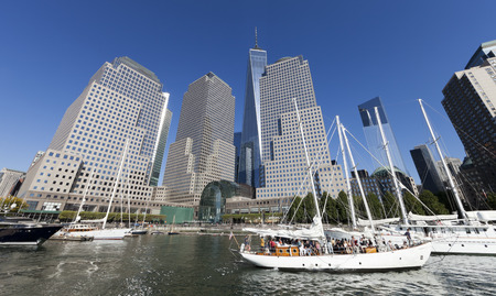 New York, USA-September 27, 2014:Tall ships docked at the North Cove Marina at Battery Park in Manhattan and financial center panoramaのeditorial素材