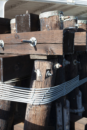 The hawser on the wooden postの写真素材