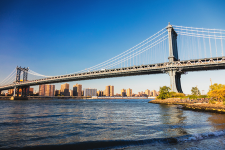 Manhattan Bridge in New York with Downtownの写真素材