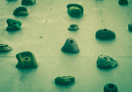 artificial sports climbing wall close-up, green filterの写真素材