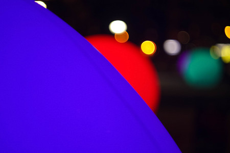 purple and red decorative balls in the park at nightの写真素材