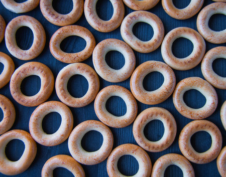 small bagels on a wooden blue background, Russian snack for teaの写真素材