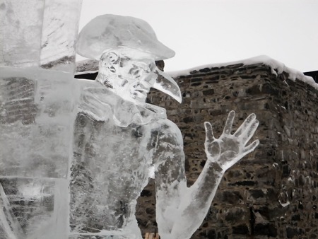 An ice sculpture of a man in a mask festival in Savonlinnaの写真素材
