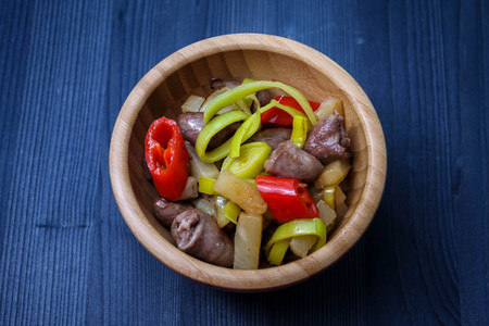 chicken hearts with leek and chili peppersの写真素材