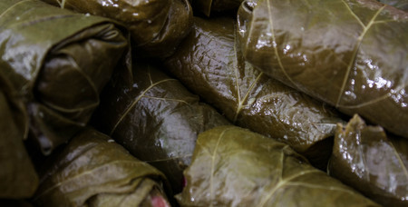 Dolma, stuffed grape leaves with rice and meat. Top view. Delicious and healthy food. Grape leaves. cooking of meal dolmaの写真素材