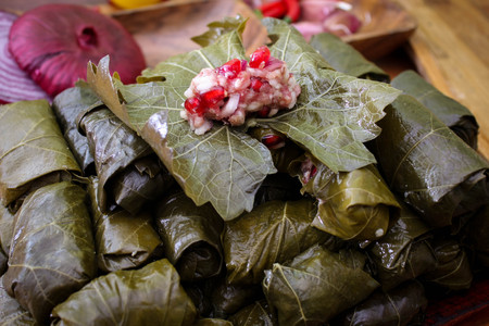 Dolma, stuffed grape leaves with rice, meat and pomegranate. Close-upの写真素材
