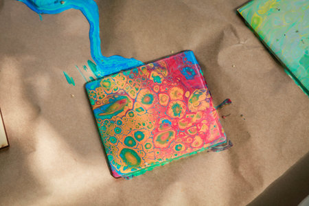 Ceramic tile filled with acrylic paint by liquid art technology. Daylight illumination