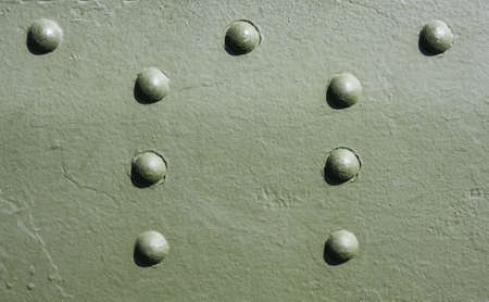 Rivets and Metal Background Dark Green Painted. Metal Military Grade Backdrop. Solar illuminationの写真素材