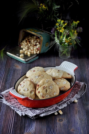 Cookies with peanuts on a metal frying panの写真素材