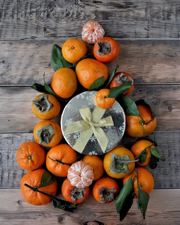 On the table are Christmas mandarins. The New Year is comingの写真素材