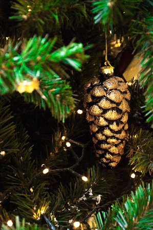 Christmas tree, spruce branches, cones. Christmas toys, decorations, giftsの写真素材