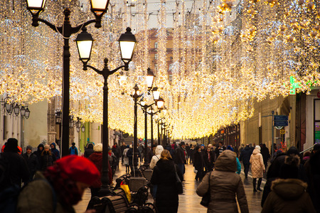 People are walking on one of the festively decorated streets in Moscowのeditorial素材