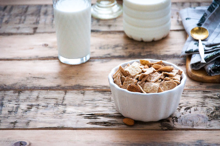 Dry healthy breakfast with nuts and a glass of milkの写真素材